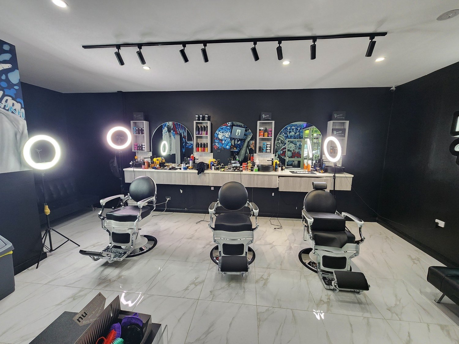Barber chairs and styling stations inside Apex Barber, Penrith